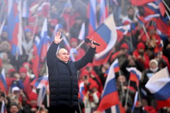 Russian President Vladimir Putin appears at a pro-war rally in Moscow.