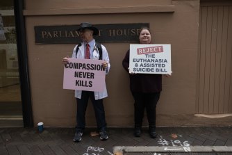 Opponents of the voluntary assisted dying bill outside NSW Parliament House.