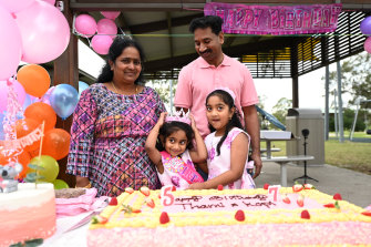 Tharnicaa Nadesalingam celebrates her fifth birthday with her parents Priya and Nades and her sister Kopika in Biloela.