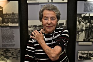 Auschwitz survivor Lotte Weiss shows her tattoo number in 2015, aged 91.