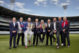 Melbourne greats (left to right) Nathan Jones, Todd Viney, current captain Max Gawn, Stan Alves, Ron Barassi, Greg Wells, Garry Lyon, David Neitz and Hassa Mann.