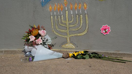 Flower tributes at the footbridge where the Bondi shootings took place.