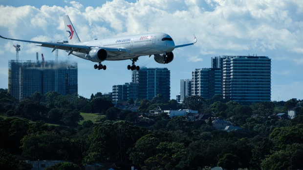 Man on Sydney-bound flight tried to open plane door mid-air, court told