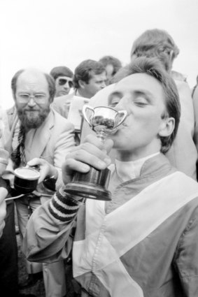 Jockey Jim Cassidy celebrates the Melbourne Cup win.