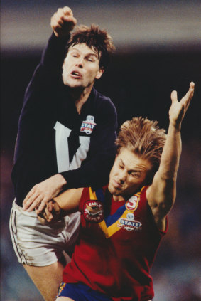 Golden fist: Danny Frawley in action against Tony Modra during a 1993 State of Origin contest.
