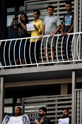 Asylum seekers protest on the balconies of a detention centre in Brisbane. 