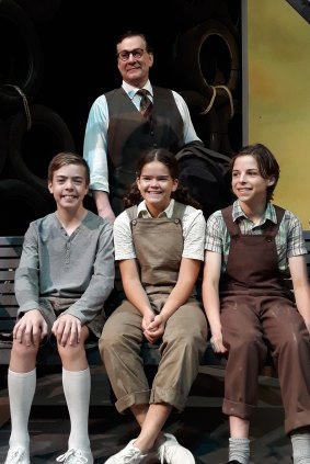Michael Sparks as Atticus Finch with (sitting l-r)  Jamie Boyd as Jem, Jade Breen as Scout and Jake Keen as Dill on the set of To Kill a Mockingbird.