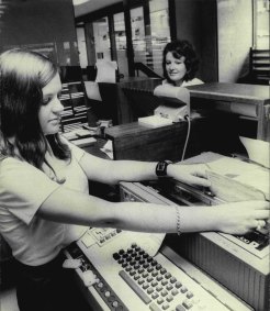 Bank tellers in action in the 1970s.