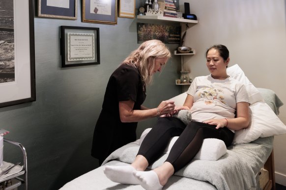 Junia Kerr applies nail varnish at her salon Sage Beauty in Bondi. The salon does not use traditional UV dryers. 