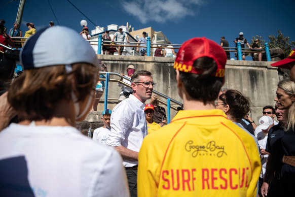 NSW Premier Dominic Perrottet speaks to volunteer surf lifesavers and Coogee nippers on Wednesday.