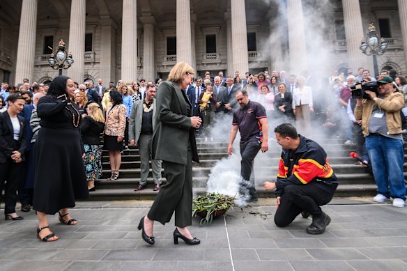Allan (centre) at the smoking ceremony outside Parliament House before the apology.