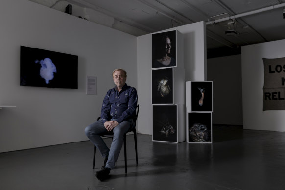 Australian Centre for Photography chief executive Pierre Arpin with photographs by Maija Tammi. 