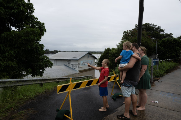 Grafton residents survey the level of the Clarence River on Monday.