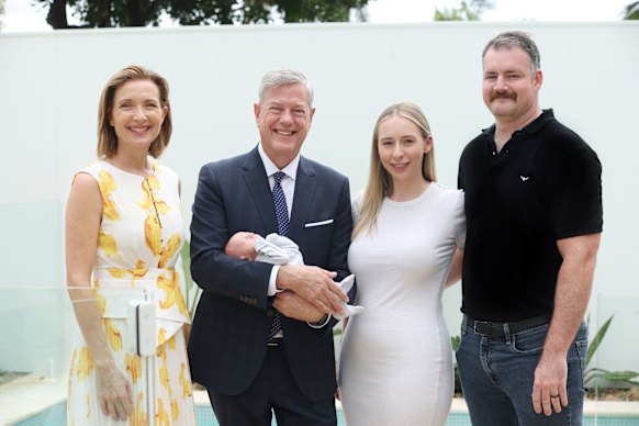Nine’s Melissa Downes and Health Minister Tim Nicholls with Ipswich parents Georgia and Elliott Gillespie and their newborn Miles.