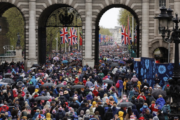 People gather at the Admiralty Arch and The Mall following the coronation ceremony.