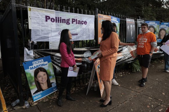 Labor candidate for Reid Sally Sitou (left) and independent candidate Natalie Baini at North Strathfield Primary on Saturday.