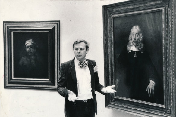 The director of the National Gallery of Victoria, Mr Patrick McCaughey, with a genuine Rembrandt. Behind him is the relegated portrait.
