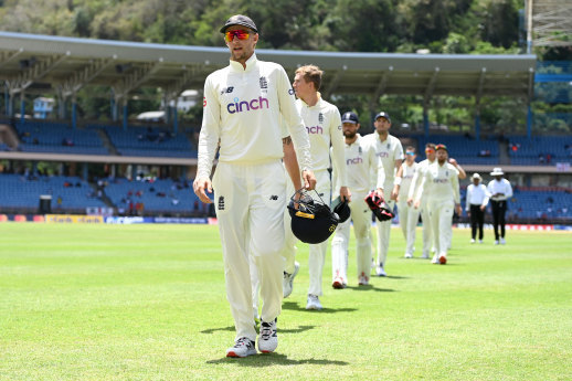 Root leads his teammates off the field.