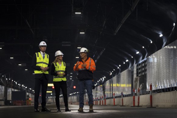 Premier Dominic Perrottet, Minister for Metropolitan Roads Natalie Ward and Transurban’s Terry Chapman inside the WestConnex motorway M4-M5 link.