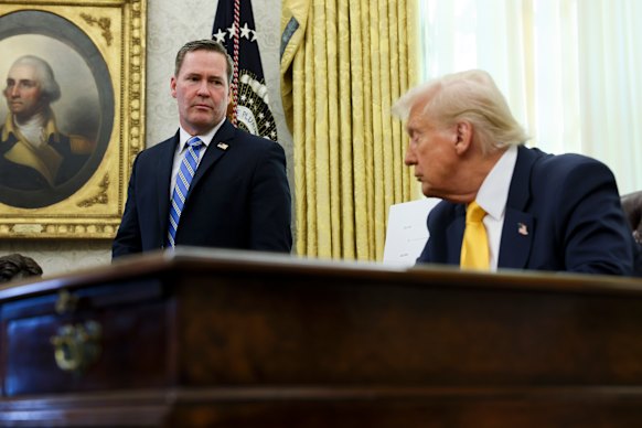 White House national security adviser Mike Waltz and President Donald Trump in the Oval Office in March.