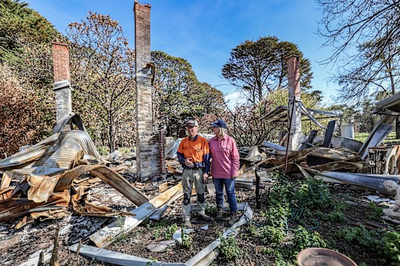 Rob and Bron Jamieson in the scorched ruins of their home. 
