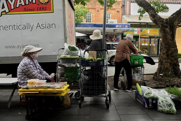 Produce sellers in Saigon Place.