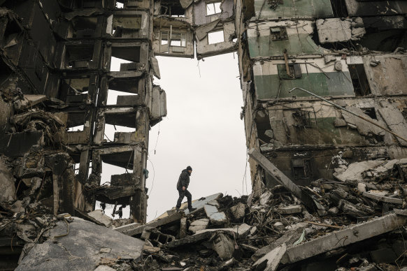 History made Russia do it: A resident looks for belongings in an apartment building during fighting in Borodyanka, Ukraine.
