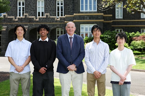Five Melbourne Grammar School students received ATAR scores of 99.95. From left are Nicholas Wang, Tahj Kumar, headmaster Philip Grutzner, Daniel Gao and Andison Zhang. The fifth student was Georgios Pirpiris.