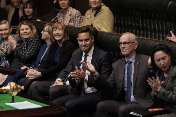 Alex Greenwich, Member for Sydney, claps as the Voluntary Assisted Dying Bill passes the lower house.