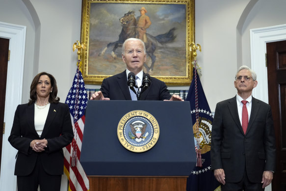 President Joe Biden speaks from the Roosevelt Room of the White House on Sunday, flanked by Vice President Kamala Harris and Attorney-General Merrick Garland.