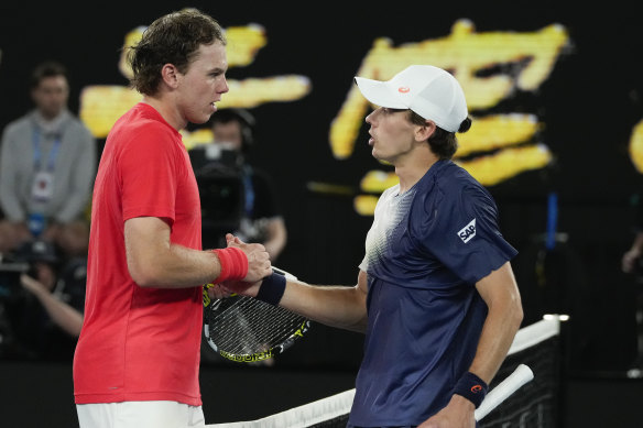 Alex de Minaur and Alex Michelsen meet at the net following the Australian’s fourth round win.