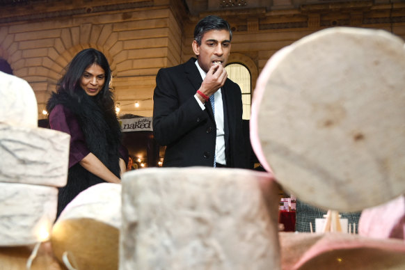 It must have been a Wednesday ...  Rishi Sunak samples cheese next to his wife Akshata Murty as they visit a food and drinks market promoting British small businesses.