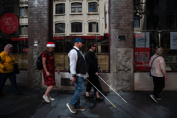 Blind and low-vision travellers on a Cocky Guides tour of Sydney’s Chinatown. 