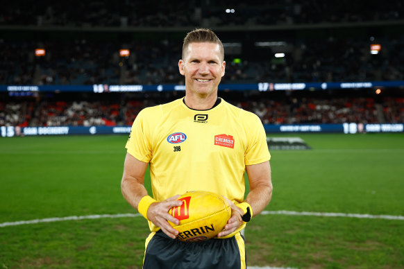AFL field umpire Simon Meredith in his 450th game.