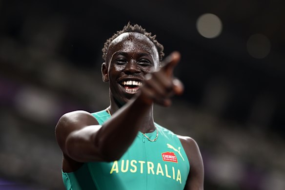Young Australian athlete Gout Gout powering down the track in a high-speed 200m race, muscles tensed and determination etched on his face.