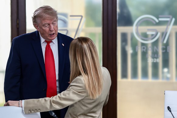 US President Donald Trump speaks with Italian Prime Minister Giorgia Meloni at a working lunch with leaders of G7 and the Middle East.