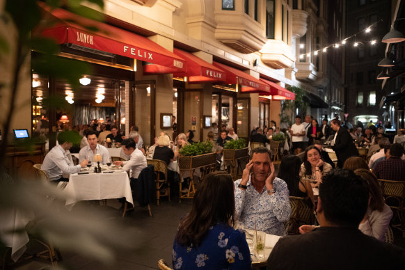 Diners on Ash Street in the Sydney CBD on Thursday night.
