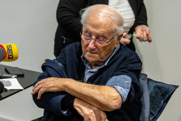 In Germany, 99-year-old Auschwitz survivor Albrecht Weinberg displays the concentration camp tattoo on his arm.