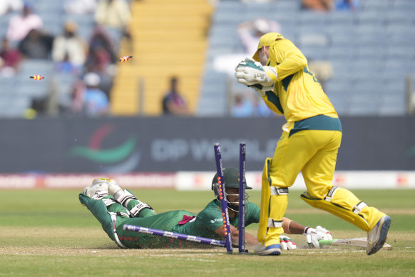 Bangladesh’s captain Shanto is run out by Australian wicketkeeper Josh Ingis.