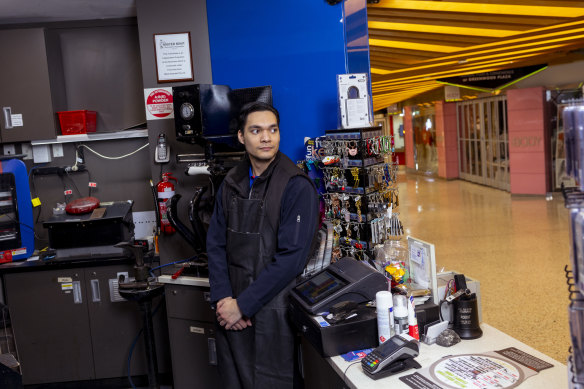 Adrian Bryan works at Mister Minit in Greenwood Plaza. He says foot traffic has been “completely dead” since the Metro opening.