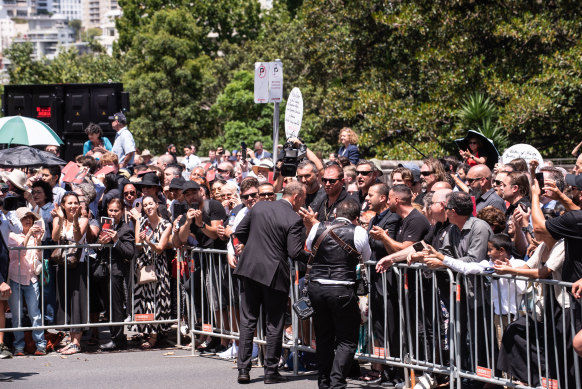 Tony Abbott greets supporters of George Pell after the funeral service at St Mary’s Cathedral.