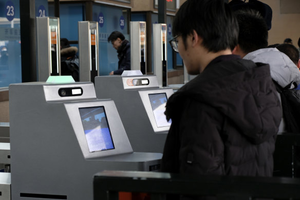 China's monitoring means rail passengers are scanned by face recognition software and are warned over the railway station's PA system to behave or their behaviour will be recorded on their social credit file.