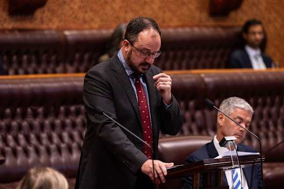 Jeremy Buckingham holds back tears as he addresses the NSW Parliament on Thursday.