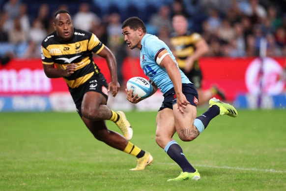 Izaia Perese makes a break for the Waratahs on Saturday.