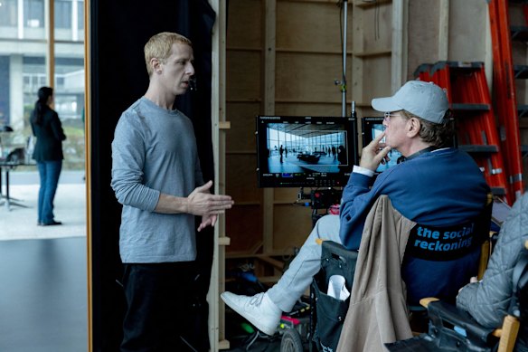 Jeremy Strong, as Mark Zuckerberg, chats with Aaron Sorkin on the set of The Social Reckoning.