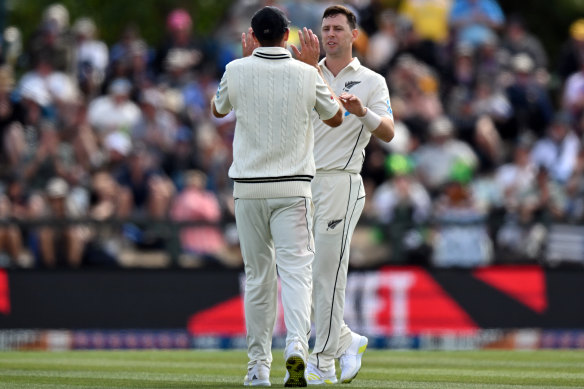 Tim Southee congratulates Matt Henry on a wicket before lunch.