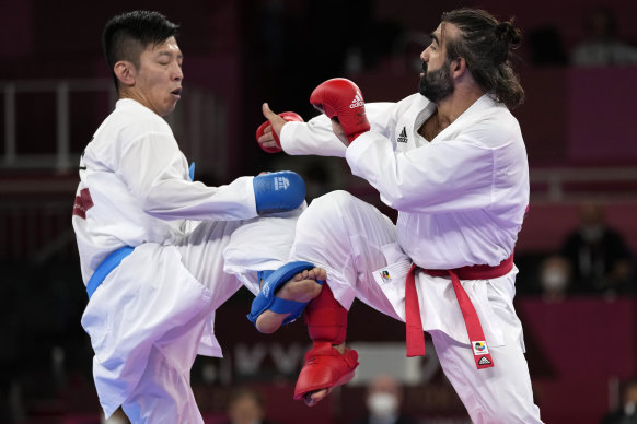 Tsuneari Yahiro of Australia, left, and Rafael Aghayev of Azerbaijan compete in the men’s karate kumite on Friday.