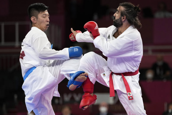 Rafael Aghayev of Azerbaijan, left, and Tsuneari Yahiro of Australia compete in the men’s kumite on Friday.