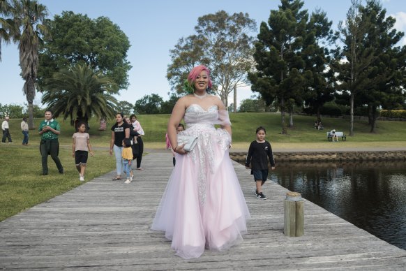 Sosefina Setefano, a year 12 student at St Clare’s, arrives at Nurragingy Reserve before her formal.