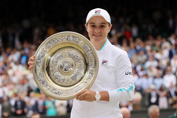 Ash Barty lifts the Venus Rosewater trophy after winning the ladies’ singles final at Wimbledon.